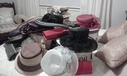 variety of hats and clutch purses